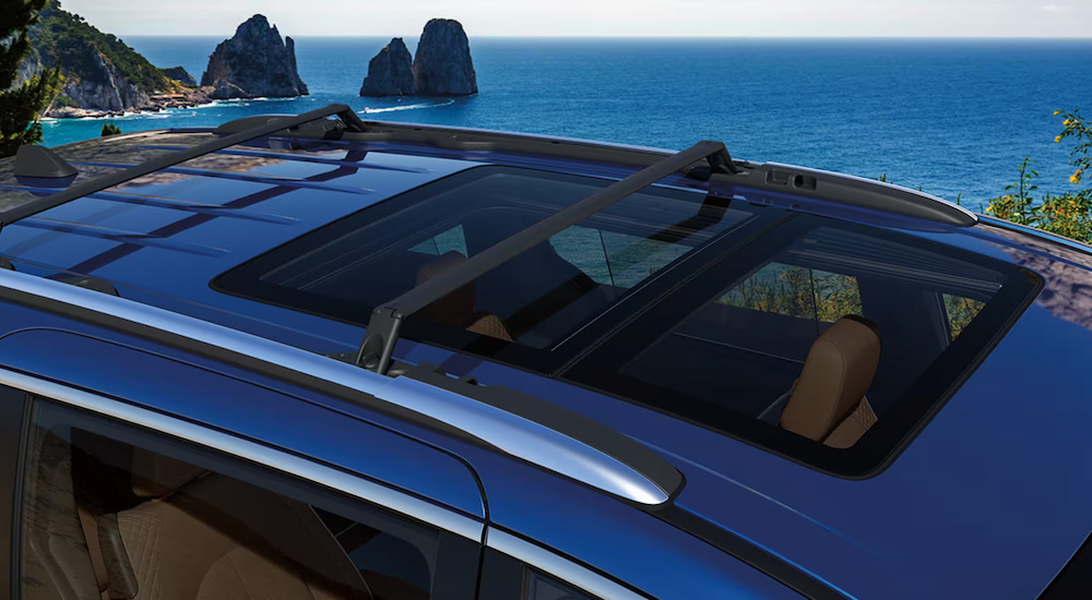 The dual-pane panoramic sunroof of a blue 2024 Chrysler Pacifica at a Chrysler dealer near Decatur.