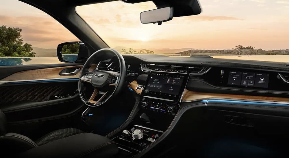 The black interior cabin of a 2024 Jeep Grand Cherokee for sale.