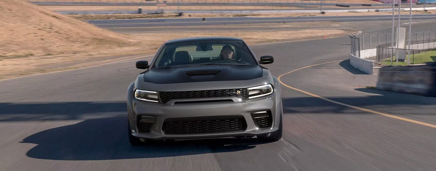 A grey 2023 Dodge Charger Scat Pack Widebody is shown from the front.